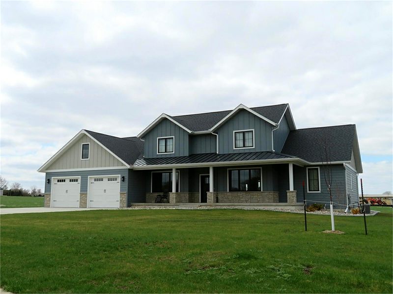Two-story gray and blue home with a covered front porch
