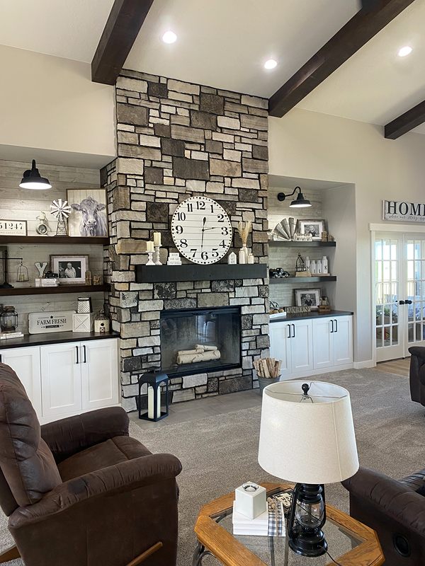 Floor-to-ceiling stone fireplace in a living room