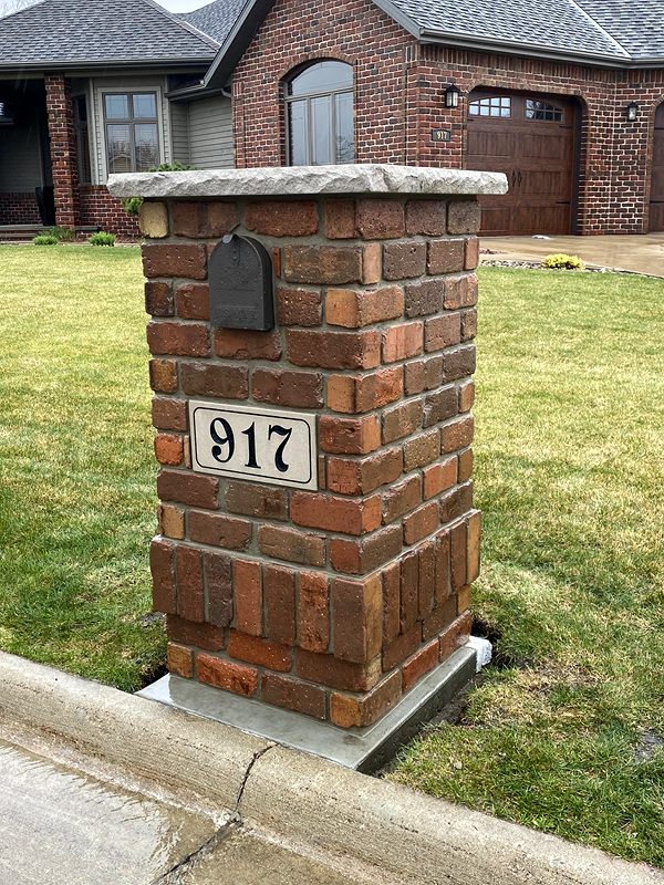 Brick mailbox column with house number